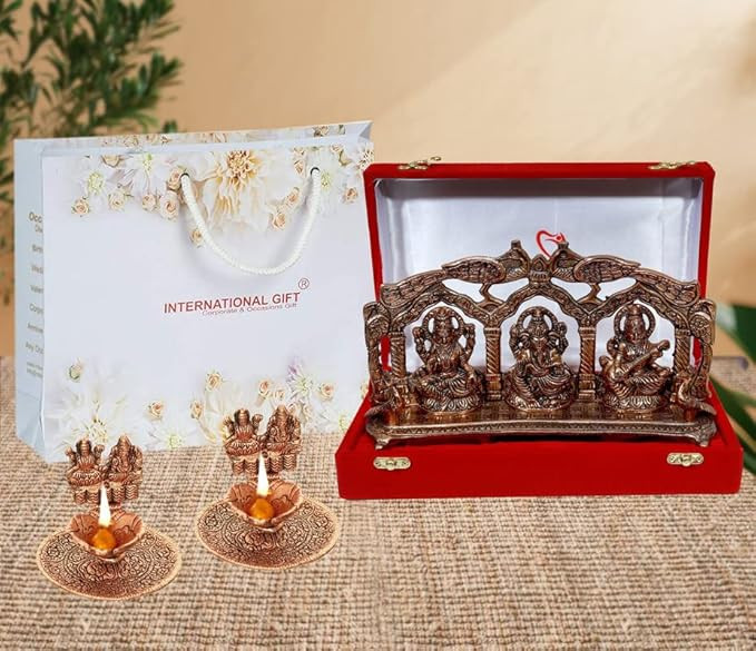 INTERNATIONAL GIFT Copper Plated Laxmi Ganesh Saraswati GodIdol Statue Oxidized Finish with 2 Piece Laxmi Ganesh Diya with Beautiful Velvet Box Packing and with Carry Bag (14H x 25W x 5L Centimeters)