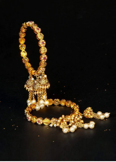 Beautiful and uniquely gold polished jhumki studded bangles