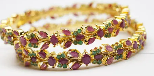 Beautiful and uniquely gold plated moti studded bangle set