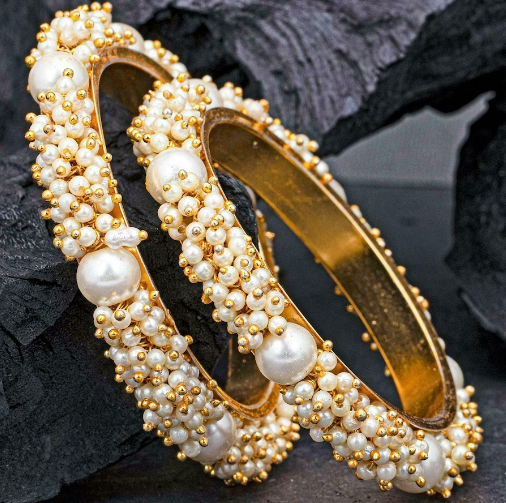 Beautiful and uniquely gold plated moti studded bangle set